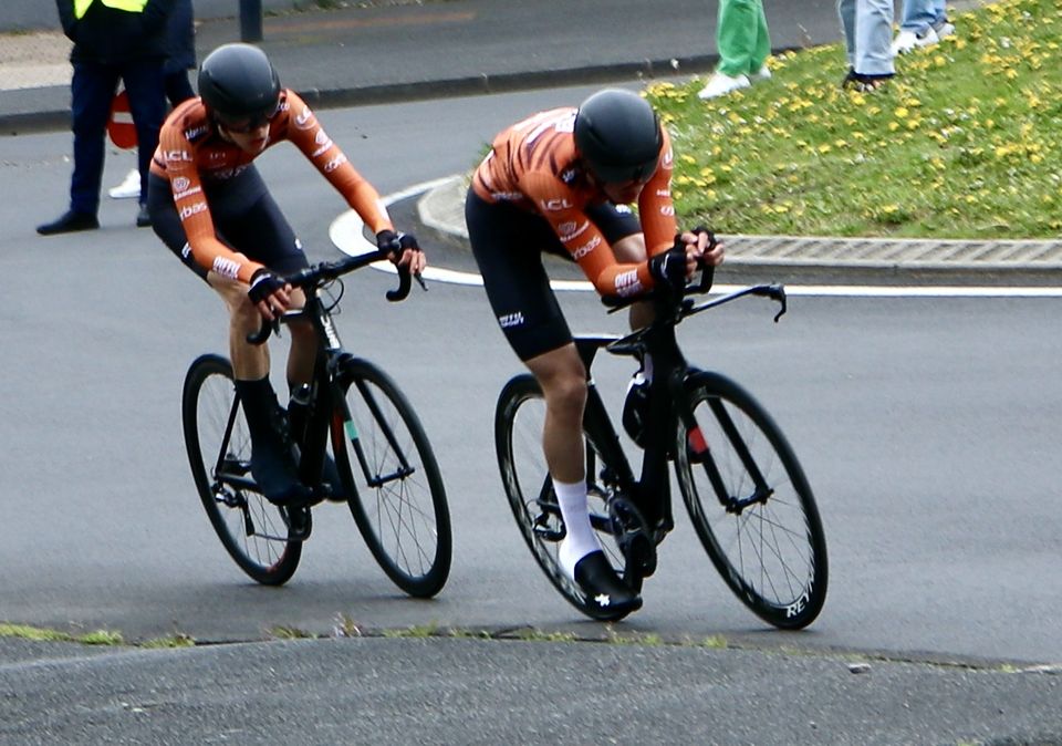 May be an image of 4 people, bicycle and text