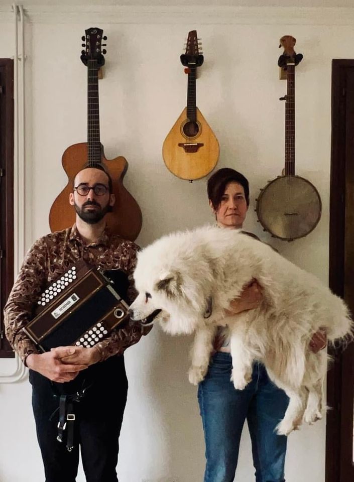 May be an image of 2 people, Great Pyrenees and accordion